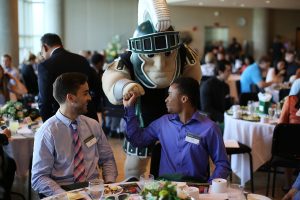 Sparty and students at scholarship lunch.