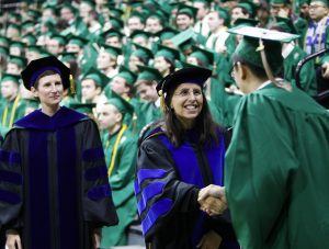 Kathy Petroni presenting diplomas