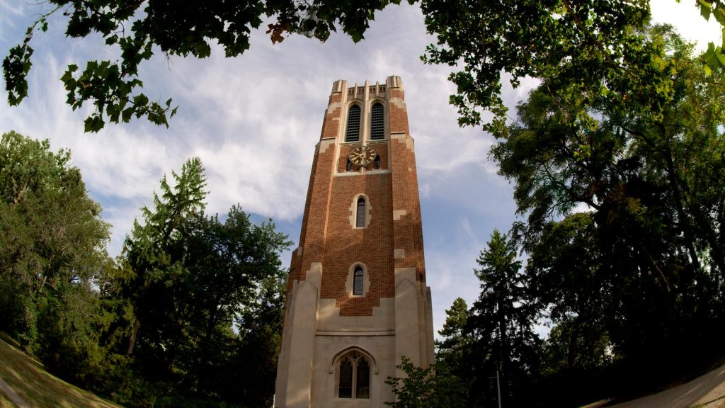 Fisheye lens view of Beaumont Tower on a sunny day on campus of MSU.