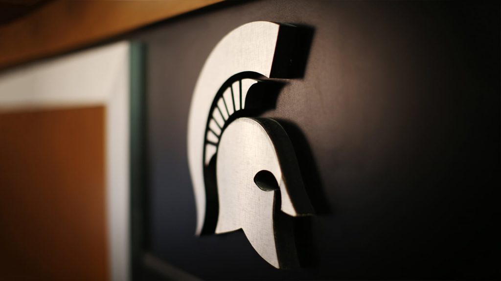 Metal Spartan Helmet on wall panel in the Eppley Center at Michigan State University