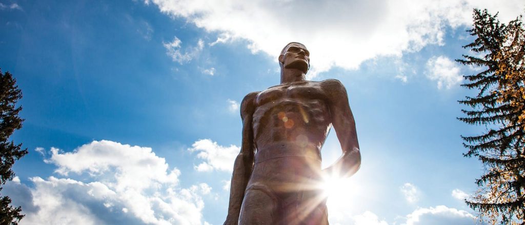 Spartan Statue with a blue sky in the background.