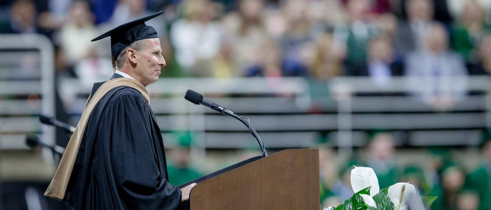 Wendy's CEO and Michigan State business school alum Todd Penegor delivers a commencement address.