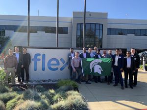 MSU Broad business school MBA students pose for group photo outside flex corporate.