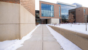 Zoom background set on a sidewalk leading up to the MSU Broad College of Business Edward J. Minskoff Pavilion