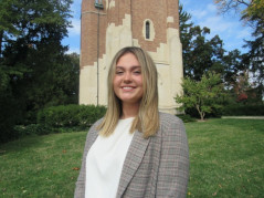 Emma Vazana poses in front of Beaumont Tower