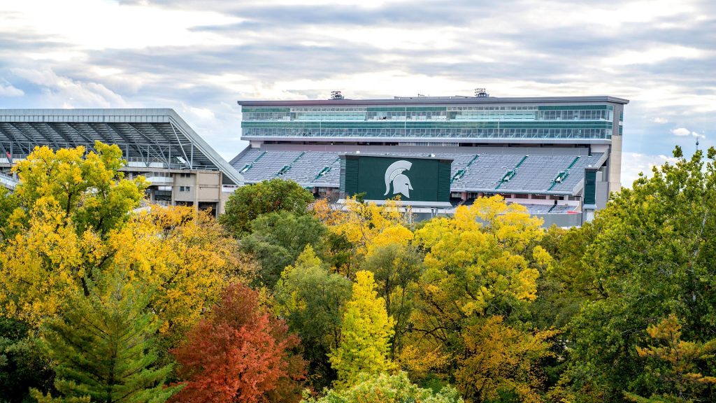 Spartan Stadium surrounded by trees during the Fall season