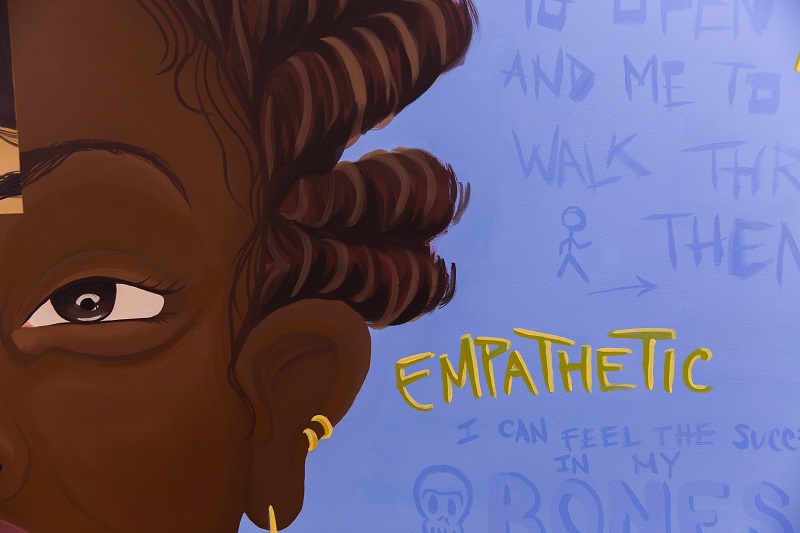 Close up of MBP mural with words 'empathetic' featured.