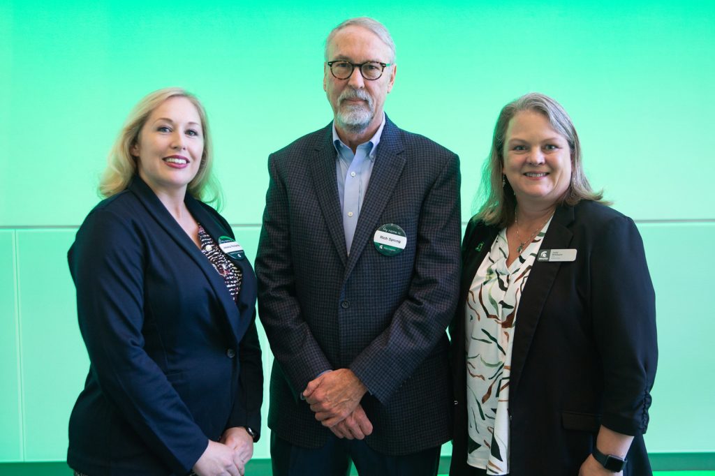 Jessica Richards, Richard Spreng and Judith Whipple pose for a picture at the MSMR Spartan Insights Summit.