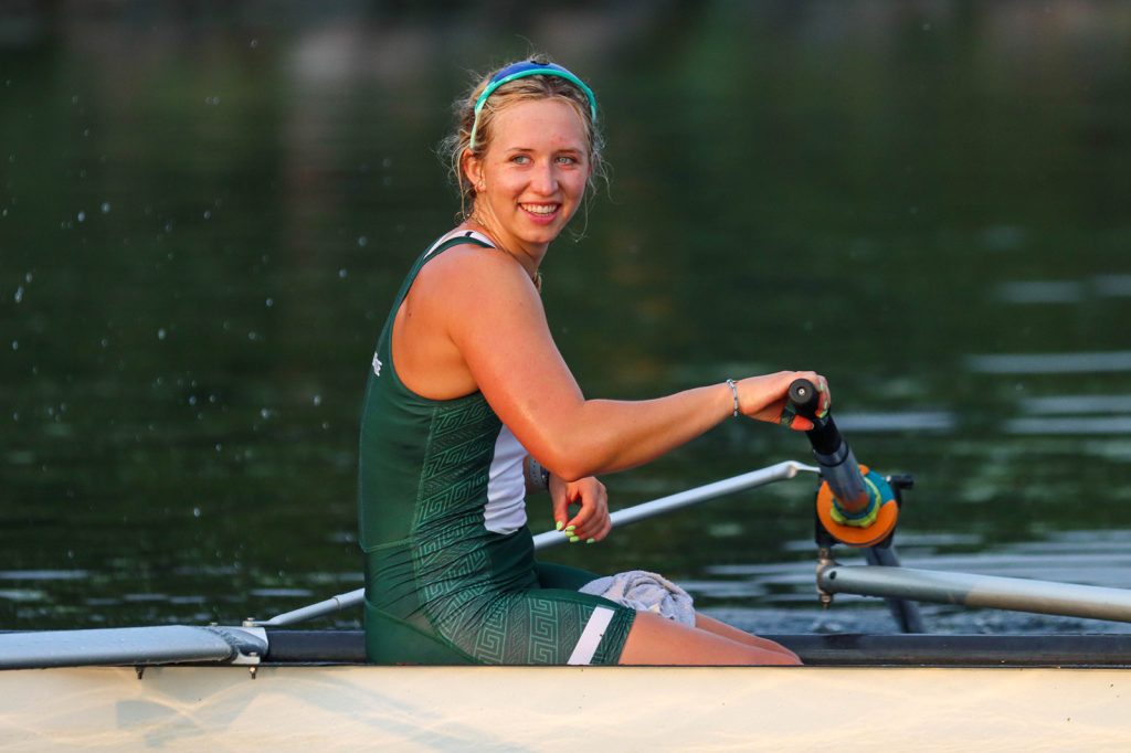 MSU rowing athlete Kendall Carlin sits in a boat after a race.