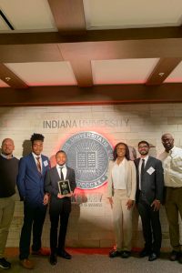 Broad students and faculty pose with their second-place prize at Indiana University.