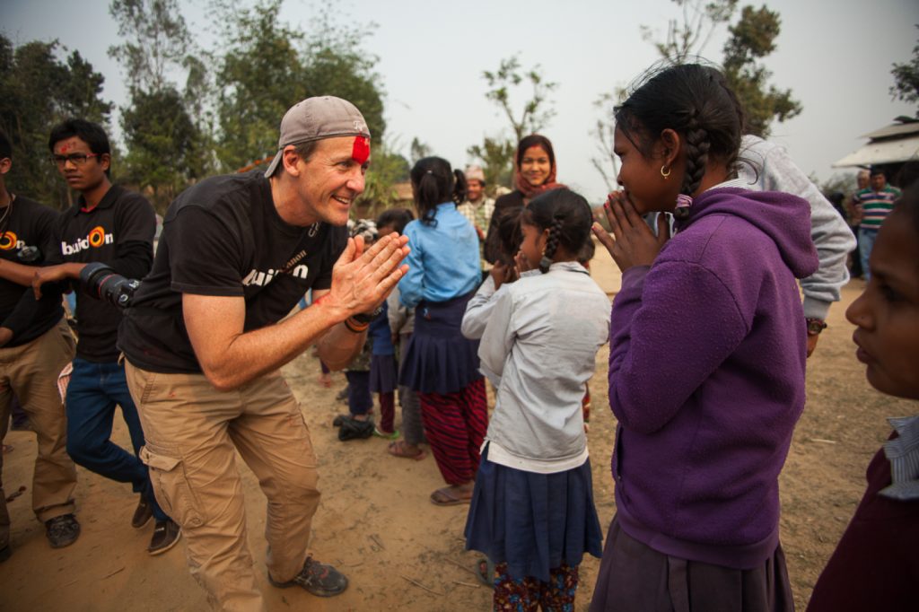 Jim Ziokowski shares a moment with children during a service trip abroad.