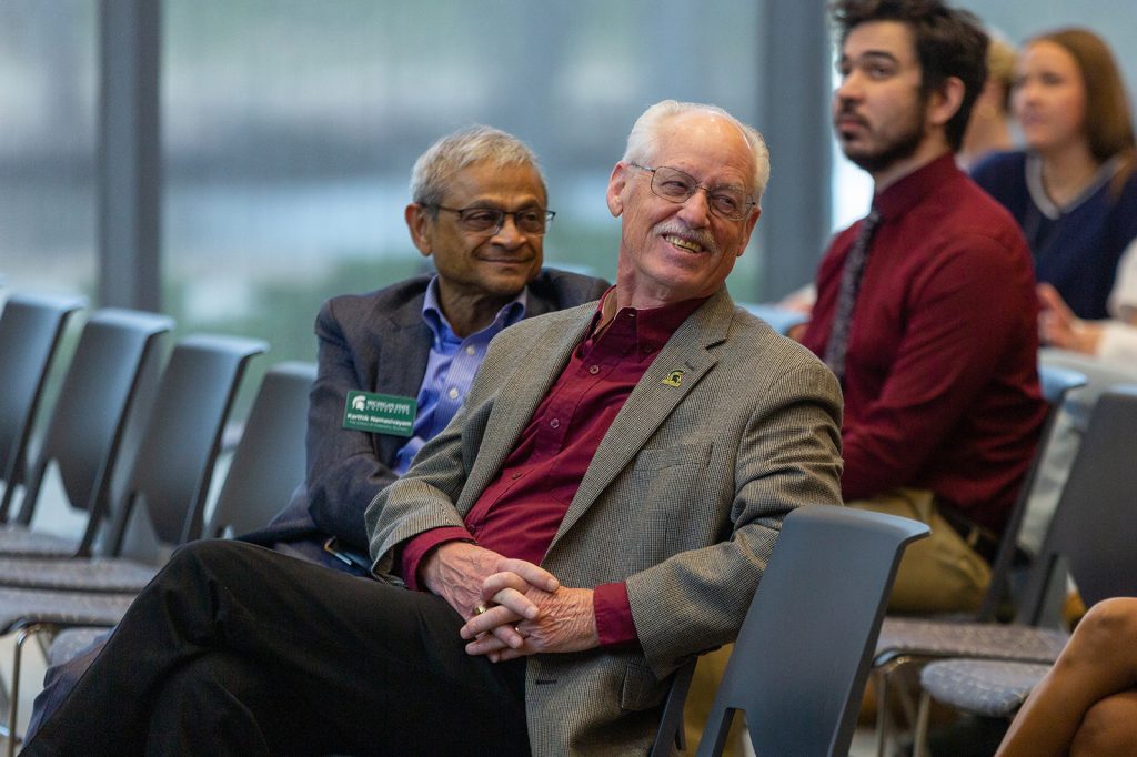 Ray Schmidgall and Karthik Namasivayam sit in attendance at the Schmidgall Lecture Series event.
