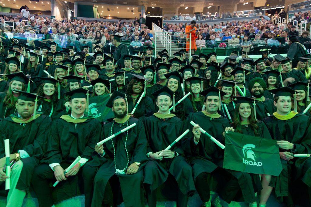 Broad College master's degree graduates fill the Breslin Center bleachers for 2023 commencement.