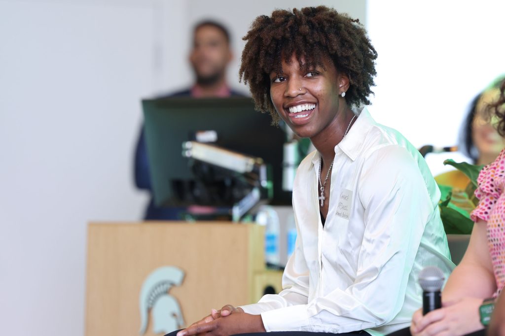 Kamaria McDaniel smiles while seated at the MSU NIL Summit.