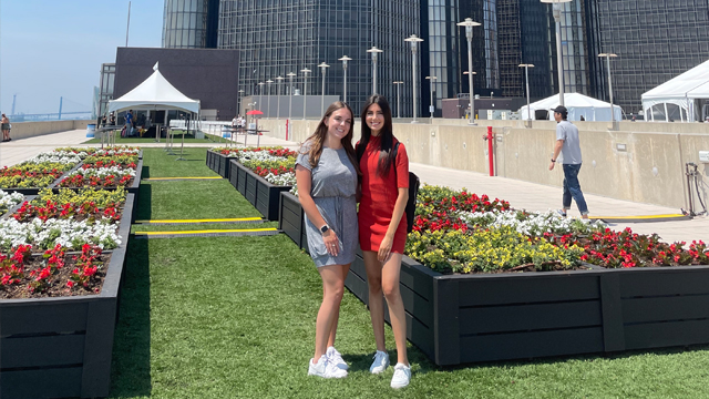 Suzanne Breen posing with another person at General Motors