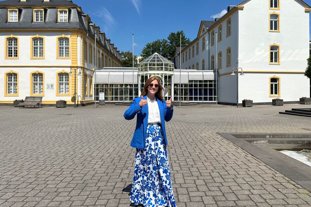Hayley Saste poses outside a university in Germany.