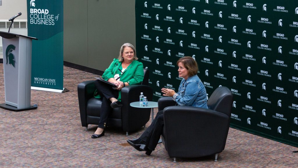 Judy Whipple and Linda Hubbard engage in a fireside chat at the 2023 Warrington Lecture event.