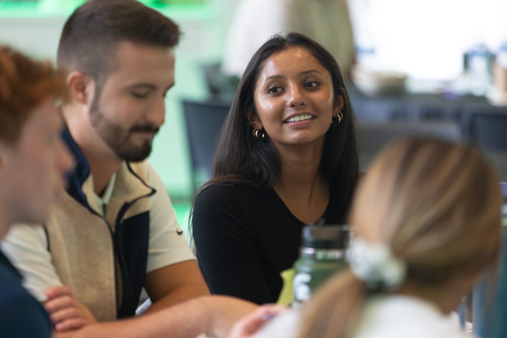 Close up of students interacting at Leadership in Action kickoff summit in the Minskoff Pavilion.