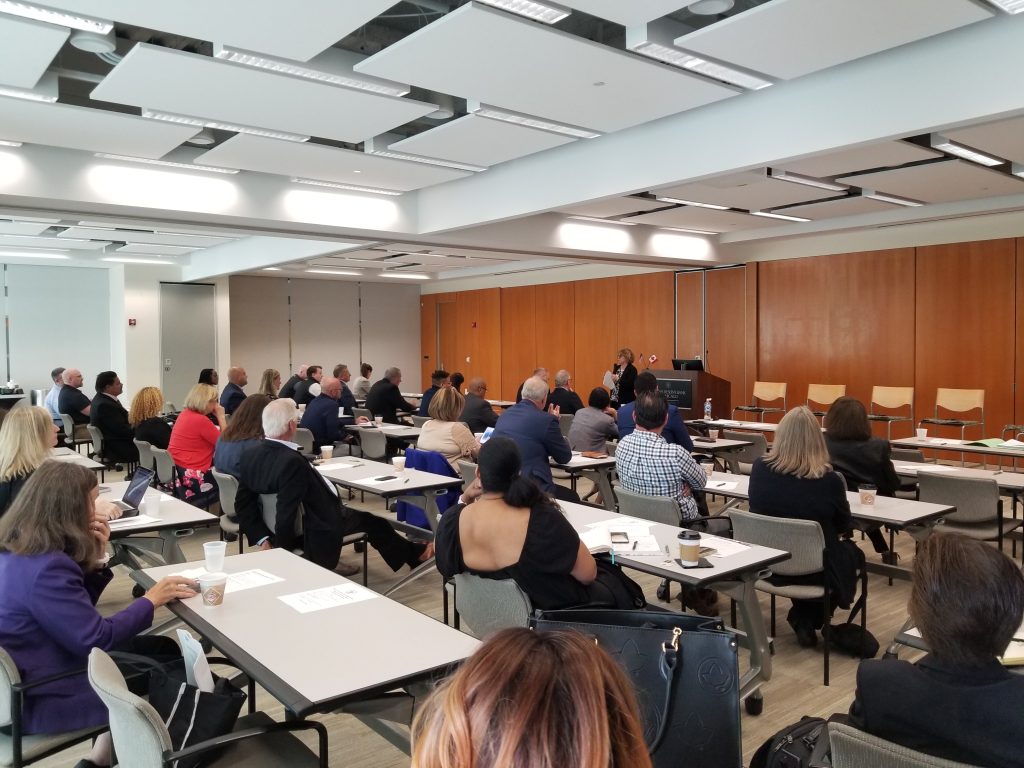 the Global Business Club event with participants listening to a keynote speaker