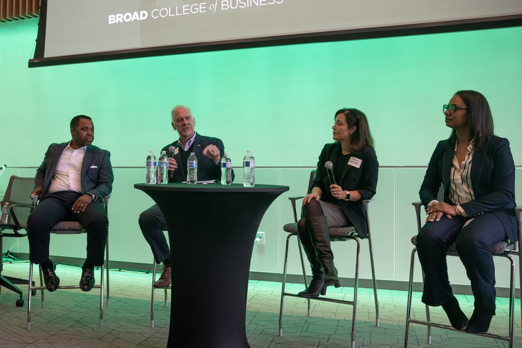 4 panelists sitting and speaking