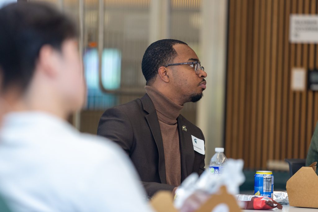 Student listening to panel discussion