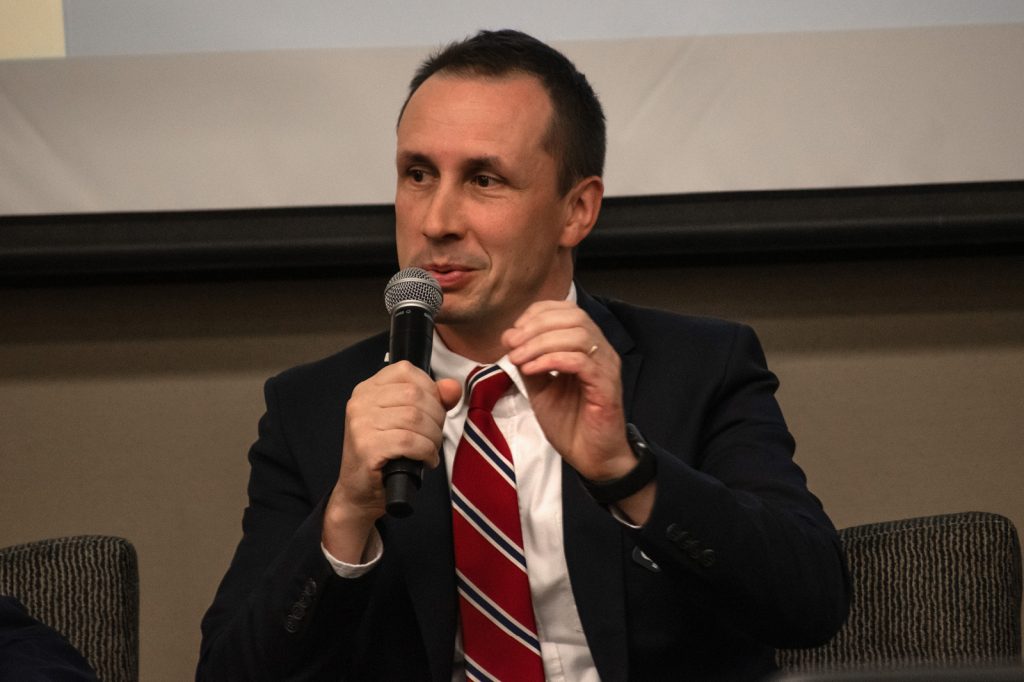 Valerii Kucherenko speaking into microphone