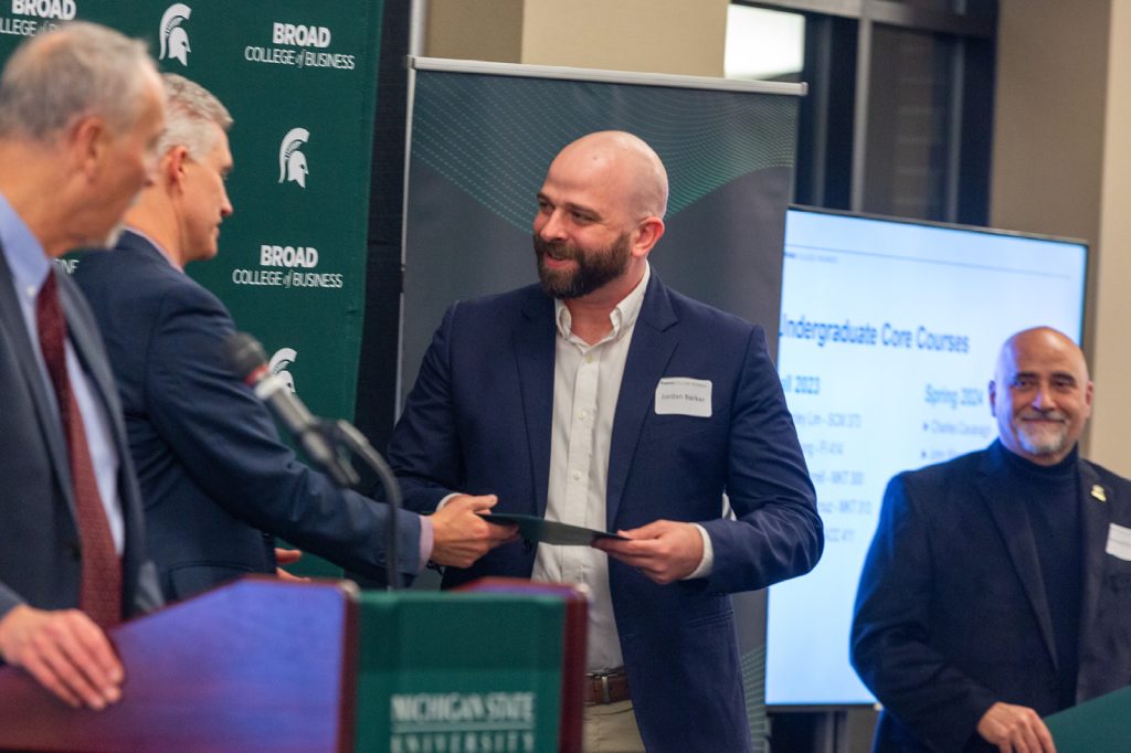 Awardee receiving award from David Souder