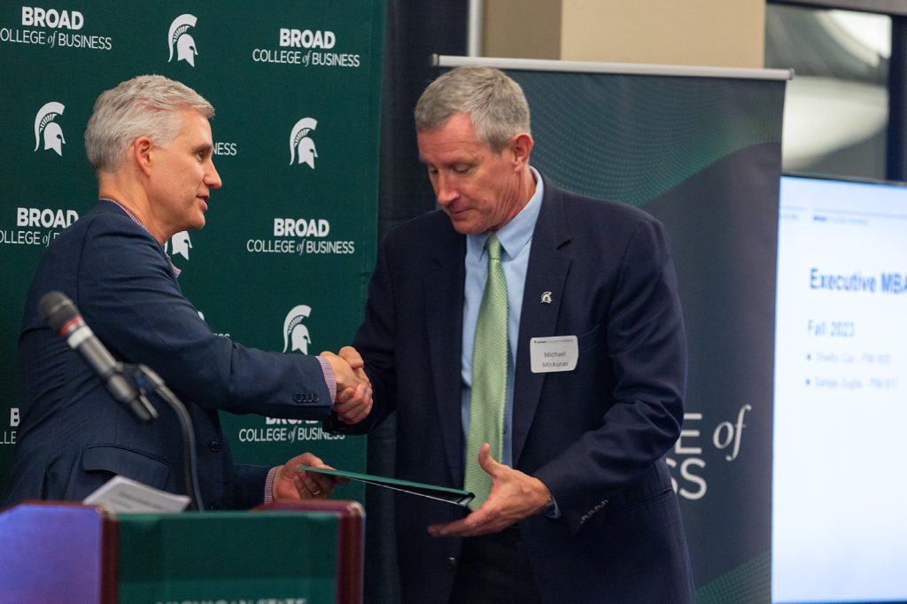 Awardee receiving award from David Souder