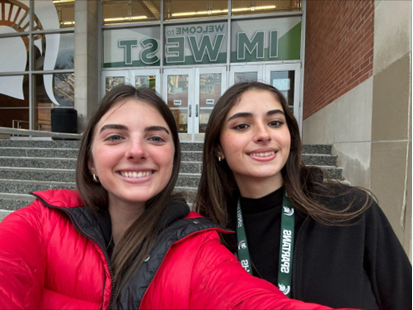 Two students smiling