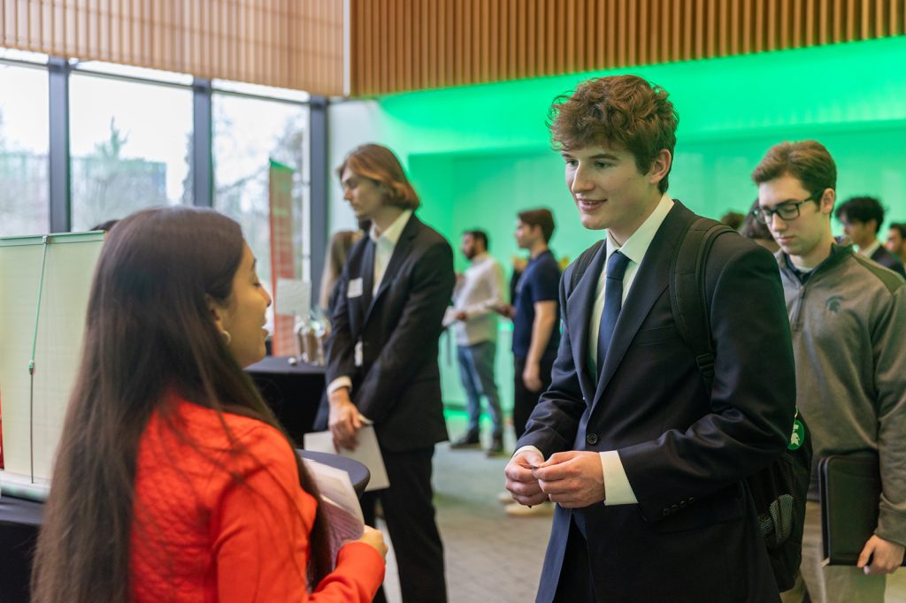 Students networking with corporate partners