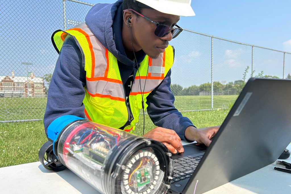 Motmot team member typing on computer