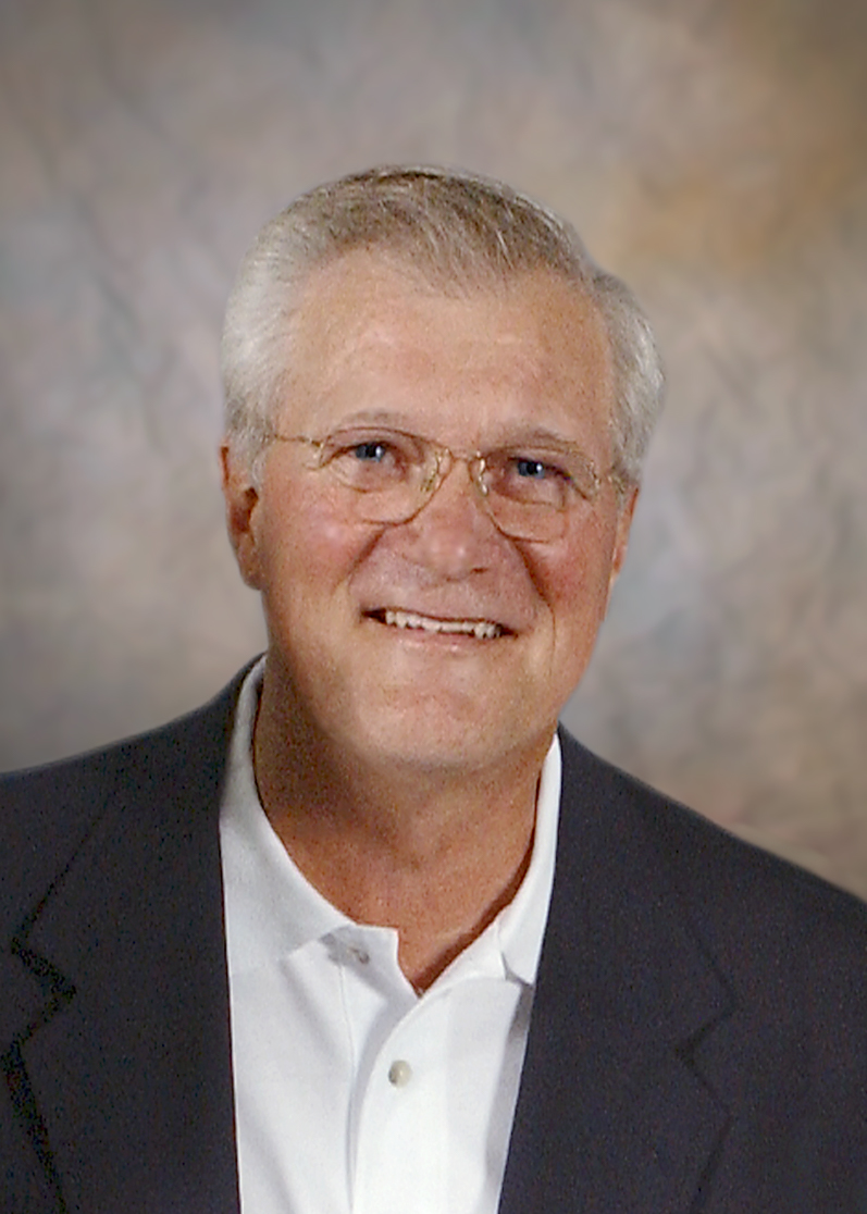 A professional headshot of Roy S. Pung