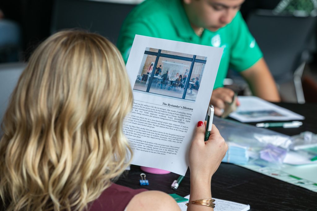 Event attendee reading event materials