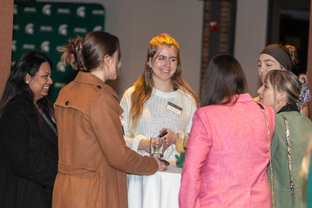 Group of people talking in a circle