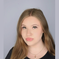 A professional headshot of Victoria Romanyshyn