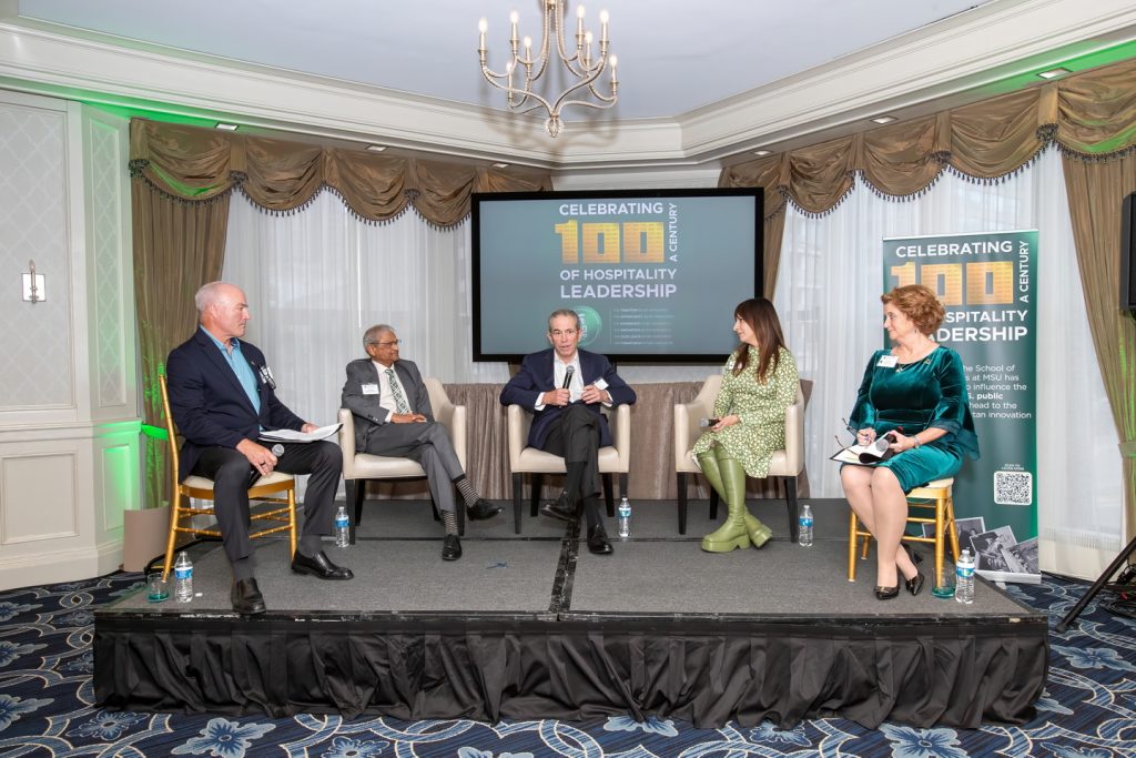 Panelists speaking at the conference