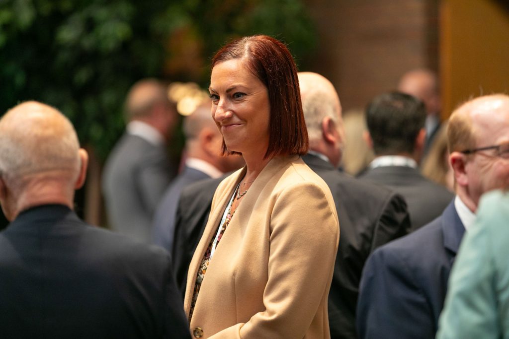 Women attending the conference engaged in a conversation