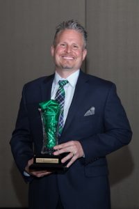 Kurt Wisniewski poses with his award