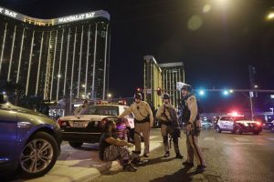 Police and survivor at the Las Vegas shooting aftermath. 