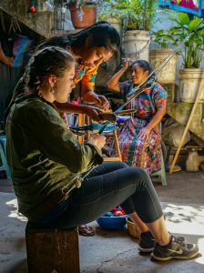 Morgan Burns (BA Accounting ’18) learning to weave in Guatemala