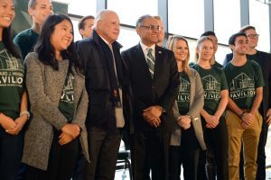 Edward J. Minskoff (left center) and Broad College of Business Dean Sanjay Gupta (center) pose with students at the Edward J. Minskoff Pavilion naming ceremony Friday, Oct. 19. Photo by Kasra Raffi