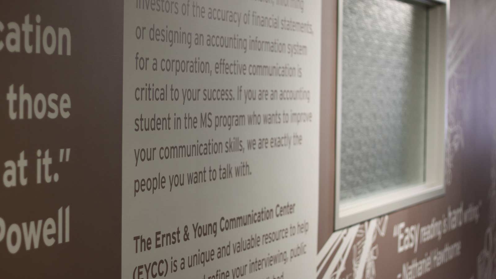 Wall inside the Ernst & Young Communication Center, filled with quotes about communication.