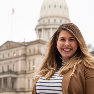 MSU Finance alumna Katelyn Wilcox in front of Michigan State Capitol