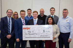 This year's Extreme Green first place team poses with their scholarship check and the executive team from Meijer.