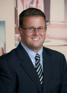 A professional headshot of alumnus Mark Bierley, CEO of Learning Care Group