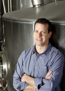A professional image of Mark Rieth (B.A. General Business ’89), owner of Atwater Brewery onsite