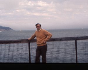 John Huetteman standing in front of a body of water.