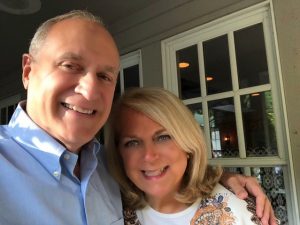 John Huetteman and his wife Candy smile for a selfie.