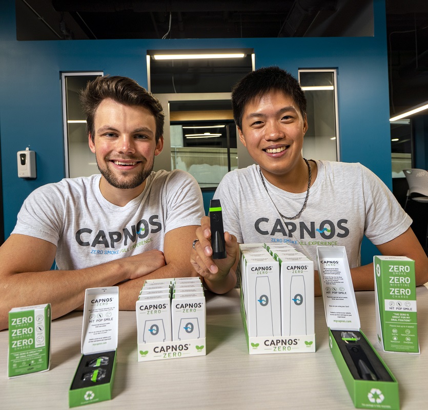 Jake Roach and Brendan Wang with their CAPNOS products.