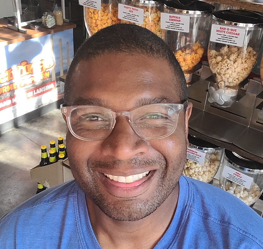 Chad Jordan headshot inside Cravings Popcorn store.